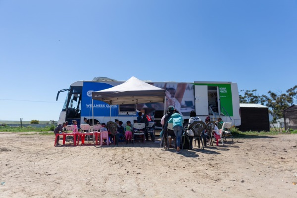 Mobile clinic visiting a school to deliver a service