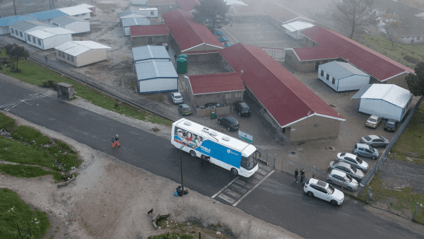 Mobile clinic parked outside a school