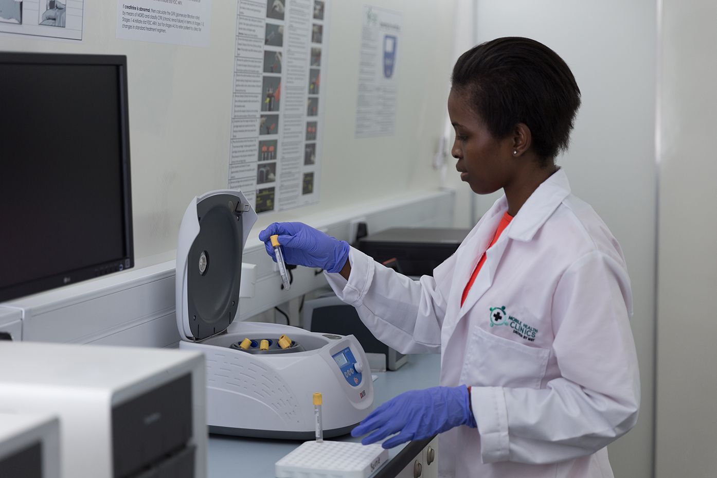 Nurse examining vials in a mobile health clinic
