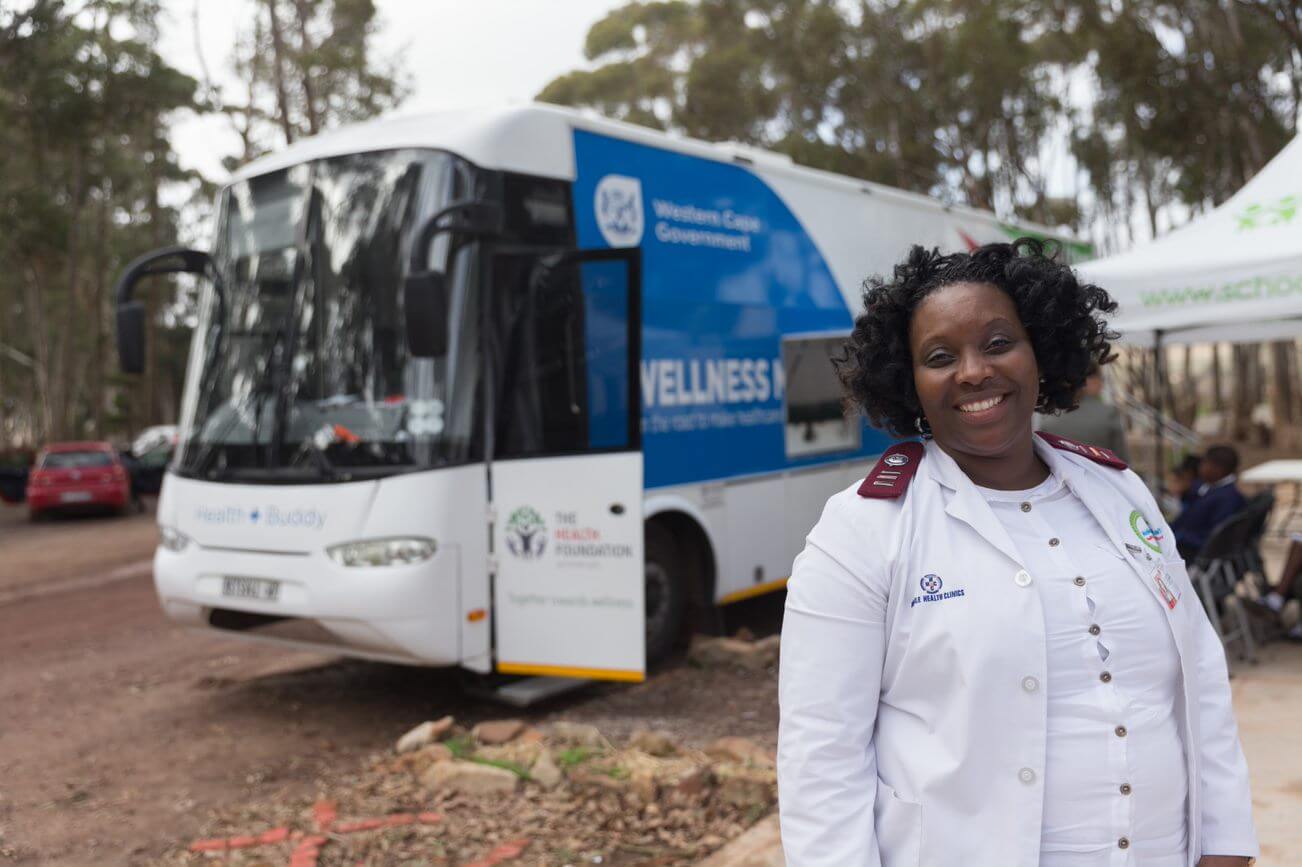 Nurse next to mobile clinic